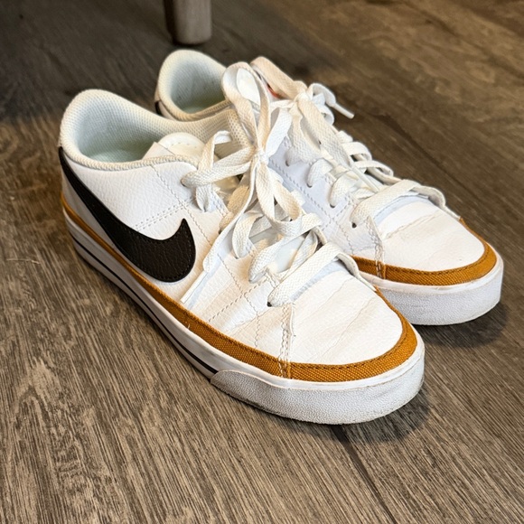 Nike Shoes - Nike White and Black Sneakers with Gold Accents